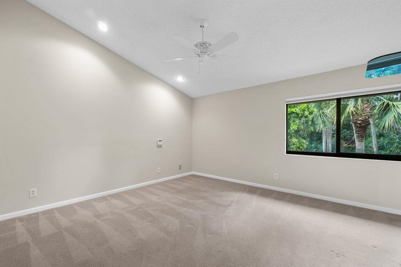 5630 Coach House Circle, Unit G Boca Raton, FL 33486 - Photo 17 of 31 PRIMARY BEDROOM W/VAULTED CEILING