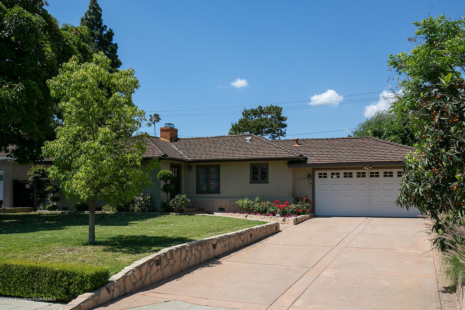 2855 Sheffield Road San Marino, CA 91108 - Photo 2 of 36 a front view of a house with a yard