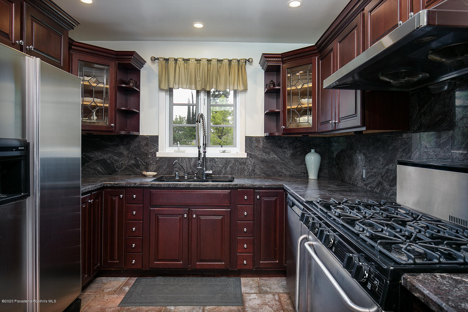 2855 Sheffield Road San Marino, CA 91108 - Photo 13 of 36 a kitchen with stainless steel appliances granite countertop a stove and a refrigerator