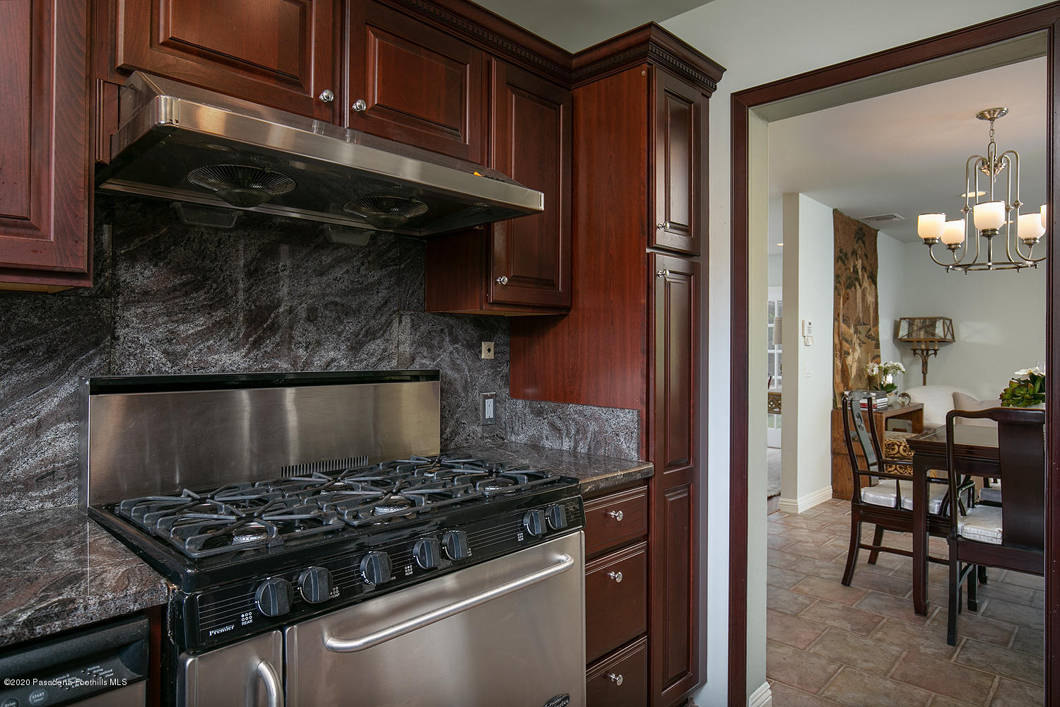 2855 Sheffield Road San Marino, CA 91108 - Photo 14 of 36 a kitchen with a stove and a dining table
