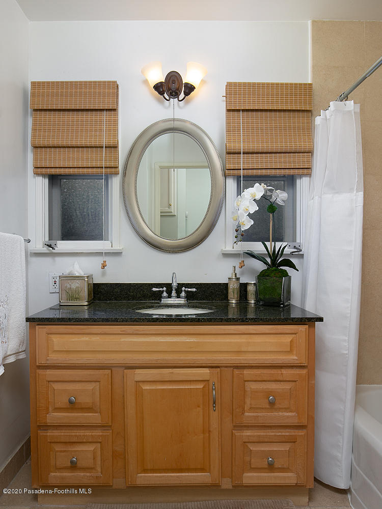 2855 Sheffield Road San Marino, CA 91108 - Photo 26 of 36 a bathroom with a sink a mirror and bathtub