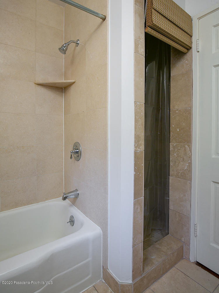 2855 Sheffield Road San Marino, CA 91108 - Photo 27 of 36 a bathroom with a tub and shower