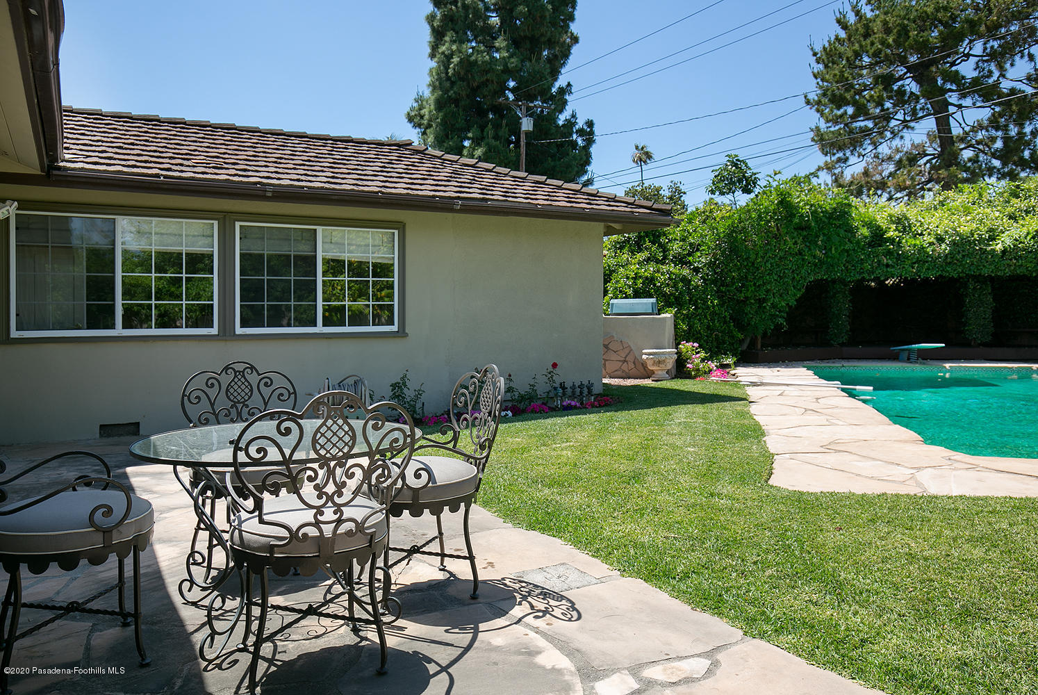 2855 Sheffield Road San Marino, CA 91108 - Photo 31 of 36 a view of a chair and table in backyard of the house