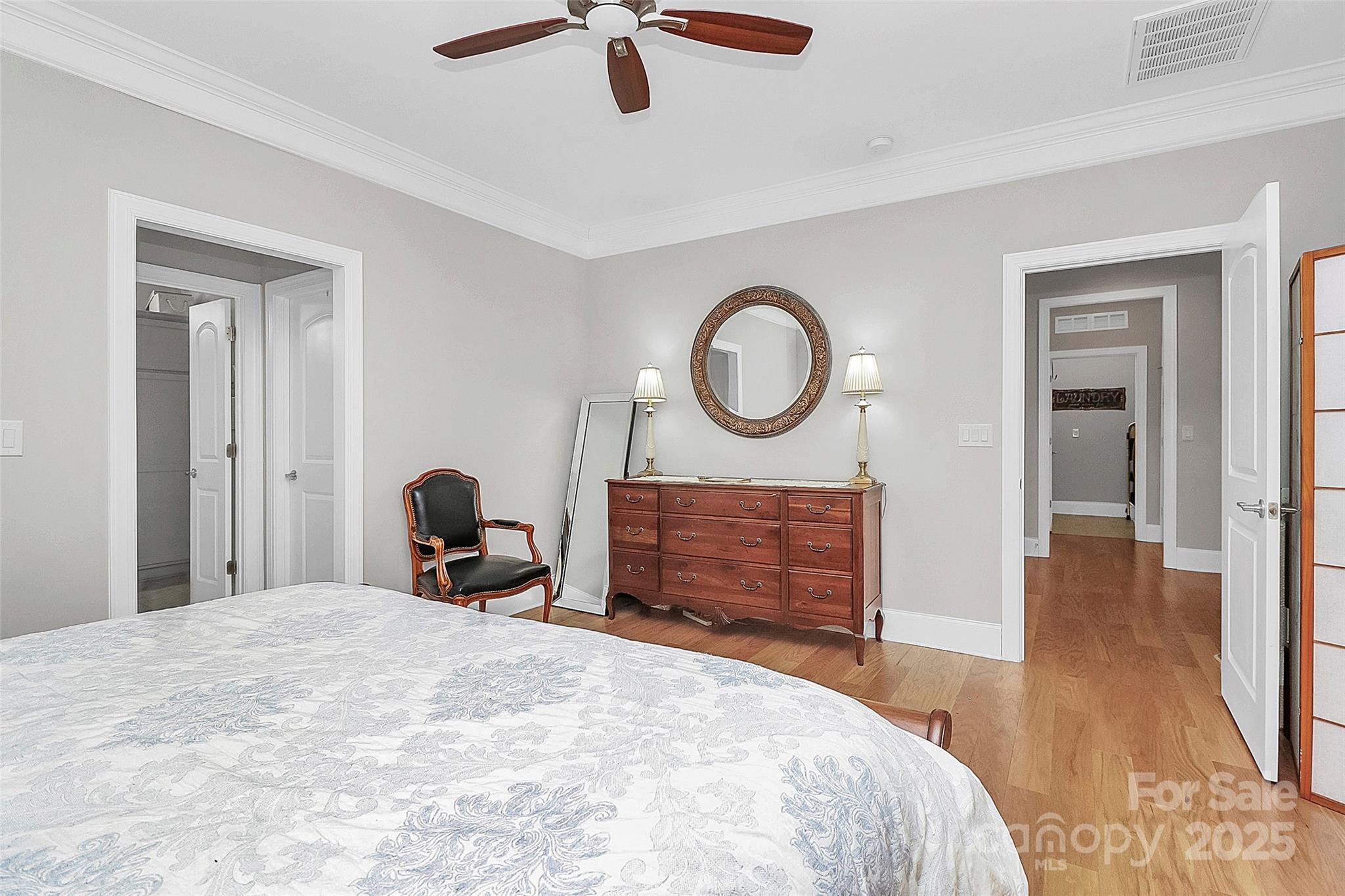 535 Chalmers Row Rock Hill, SC 29732 - Photo 20 of 38 a bedroom with a bed and a chandelier