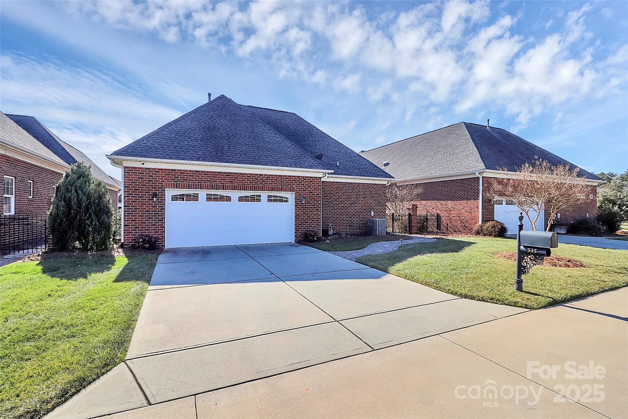 535 Chalmers Row Rock Hill, SC 29732 - Photo 28 of 38 a front view of a house with a yard and garage