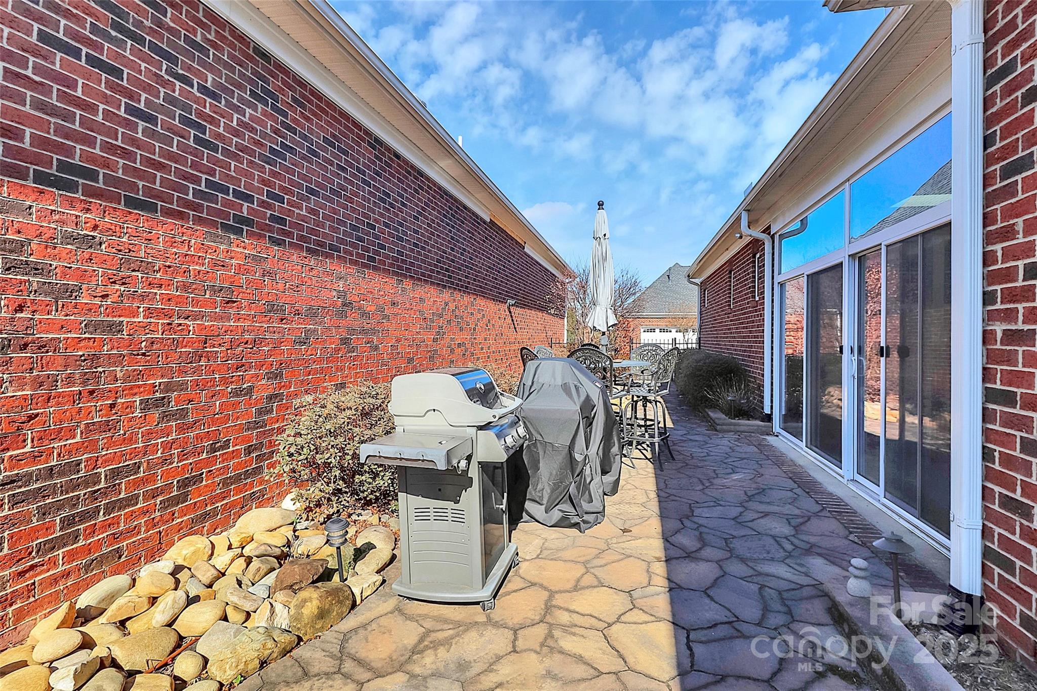 535 Chalmers Row Rock Hill, SC 29732 - Photo 31 of 38 a view of a patio with table and chairs and potted plants