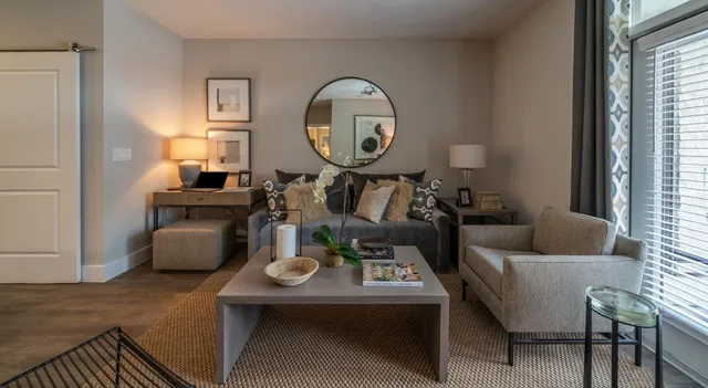 a living room with furniture and a window