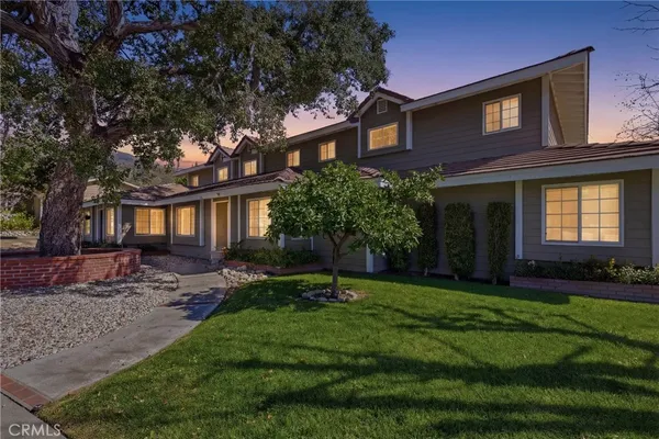 a house view with a garden space