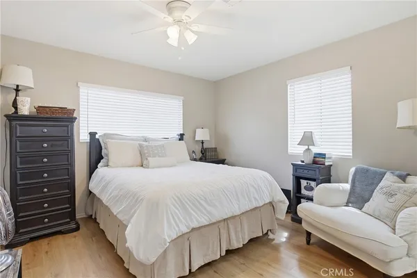 a bathroom with a sink a toilet and a window