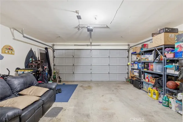 a view of balcony with furniture and umbrella