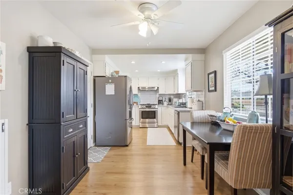 a dining room with furniture and window