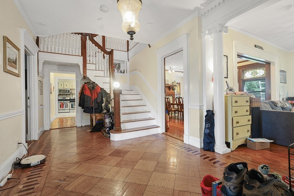70 Peter Parley Road Boston, MA 02130 - Photo 12 of 35 a view of a livingroom with furniture and stairs