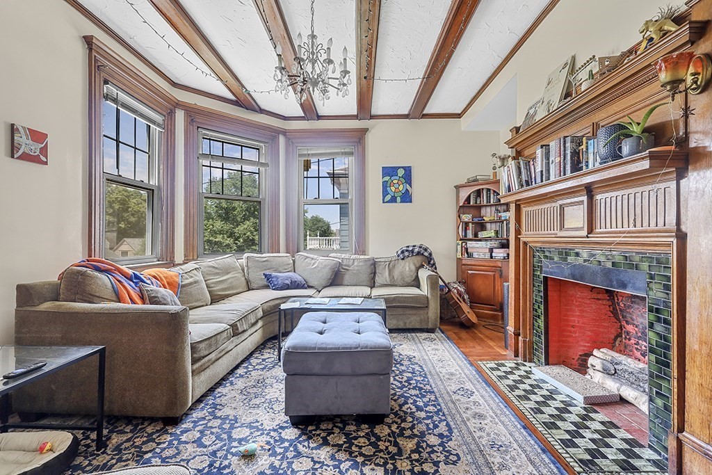 70 Peter Parley Road Boston, MA 02130 - Photo 13 of 35 a living room with furniture a rug and a fireplace