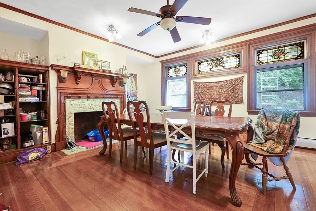 70 Peter Parley Road Boston, MA 02130 - Photo 14 of 35 a view of a dining room with furniture window and wooden floor