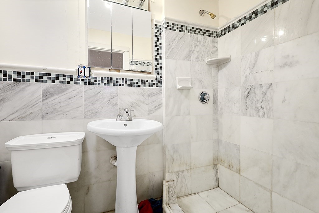 70 Peter Parley Road Boston, MA 02130 - Photo 18 of 35 a bathroom with a sink toilet and shower