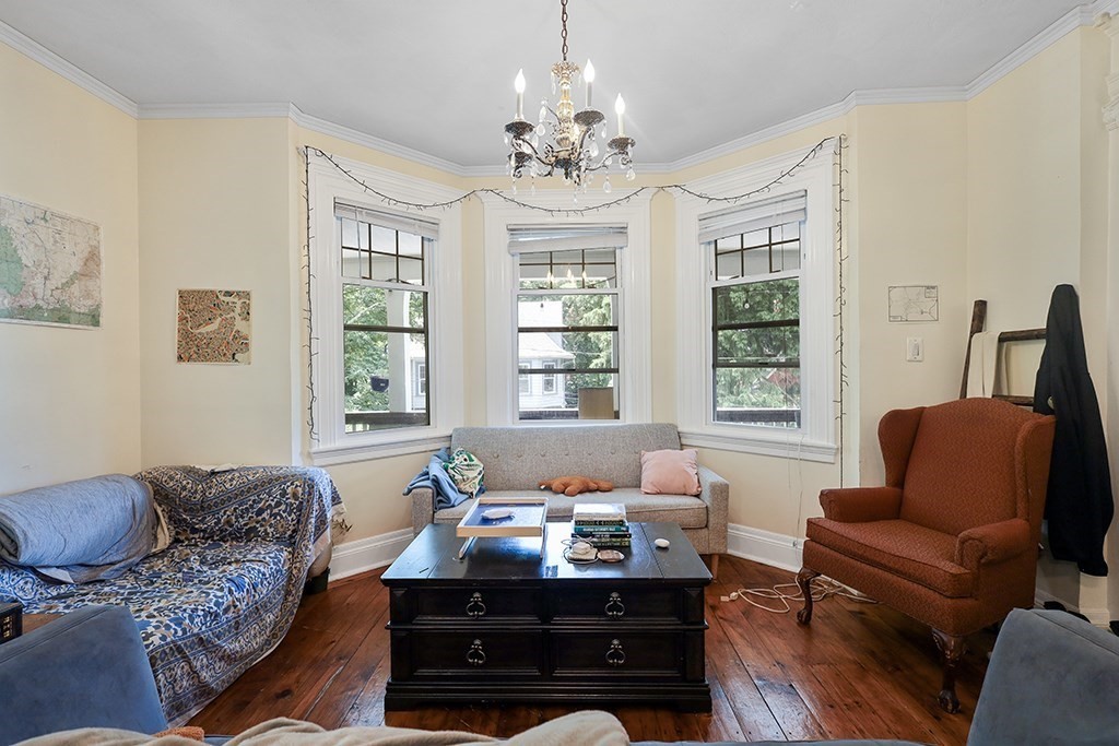 70 Peter Parley Road Boston, MA 02130 - Photo 20 of 35 a living room with furniture or chandelier and a window