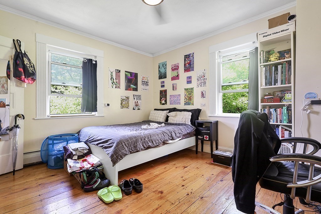 70 Peter Parley Road Boston, MA 02130 - Photo 25 of 35 a bedroom with a bed and a couch