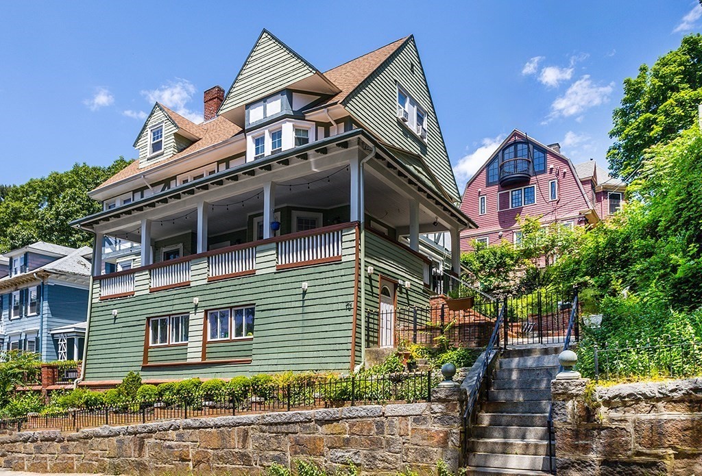 70 Peter Parley Road Boston, MA 02130 - Photo 4 of 35 a view of a house with a yard and potted plants