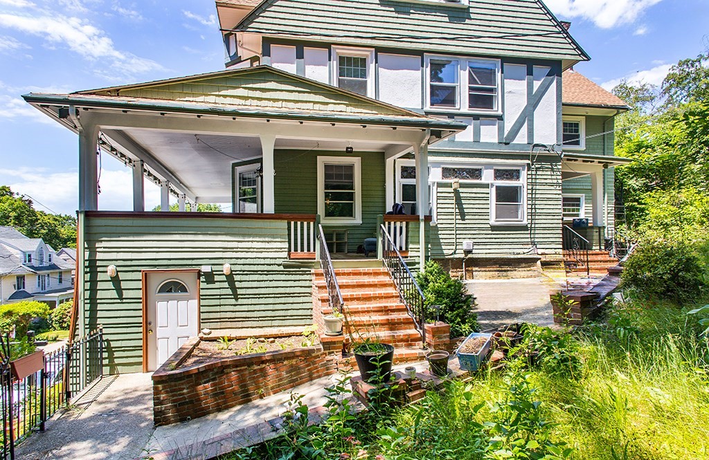 70 Peter Parley Road Boston, MA 02130 - Photo 6 of 35 a front view of a house with garden