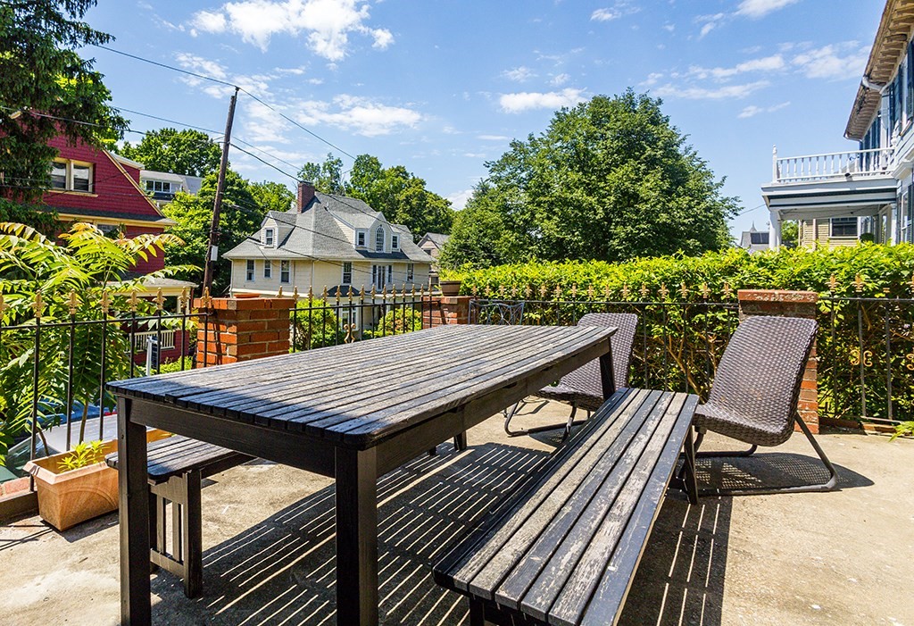 70 Peter Parley Road Boston, MA 02130 - Photo 8 of 35 a view of a patio with table and chairs and potted plants