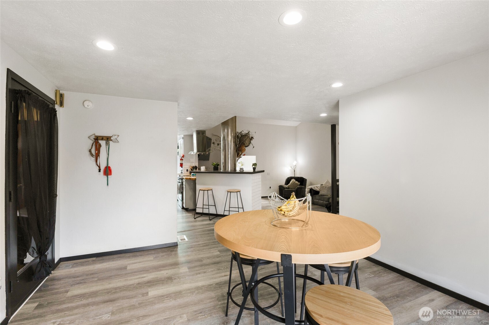 9307 Albert Way Southeast Moses Lake, WA 98837 - Photo 11 of 40 a view of a room with furniture and wooden floor