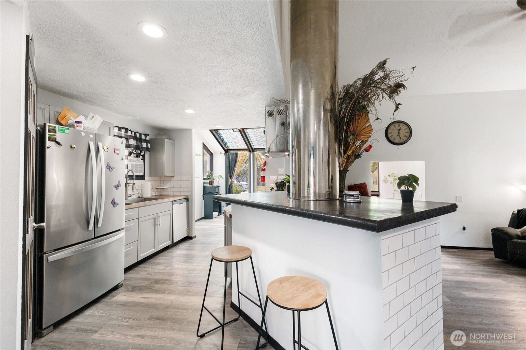 9307 Albert Way Southeast Moses Lake, WA 98837 - Photo 12 of 40 a kitchen with stainless steel appliances a refrigerator a sink and a stove