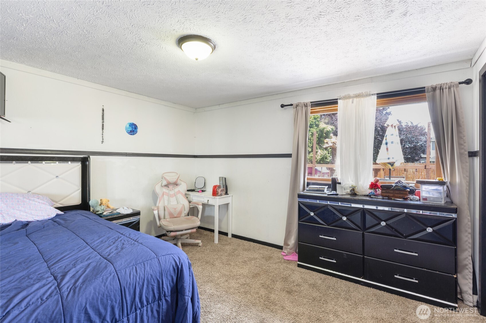 9307 Albert Way Southeast Moses Lake, WA 98837 - Photo 26 of 40 a bedroom with a bed and window