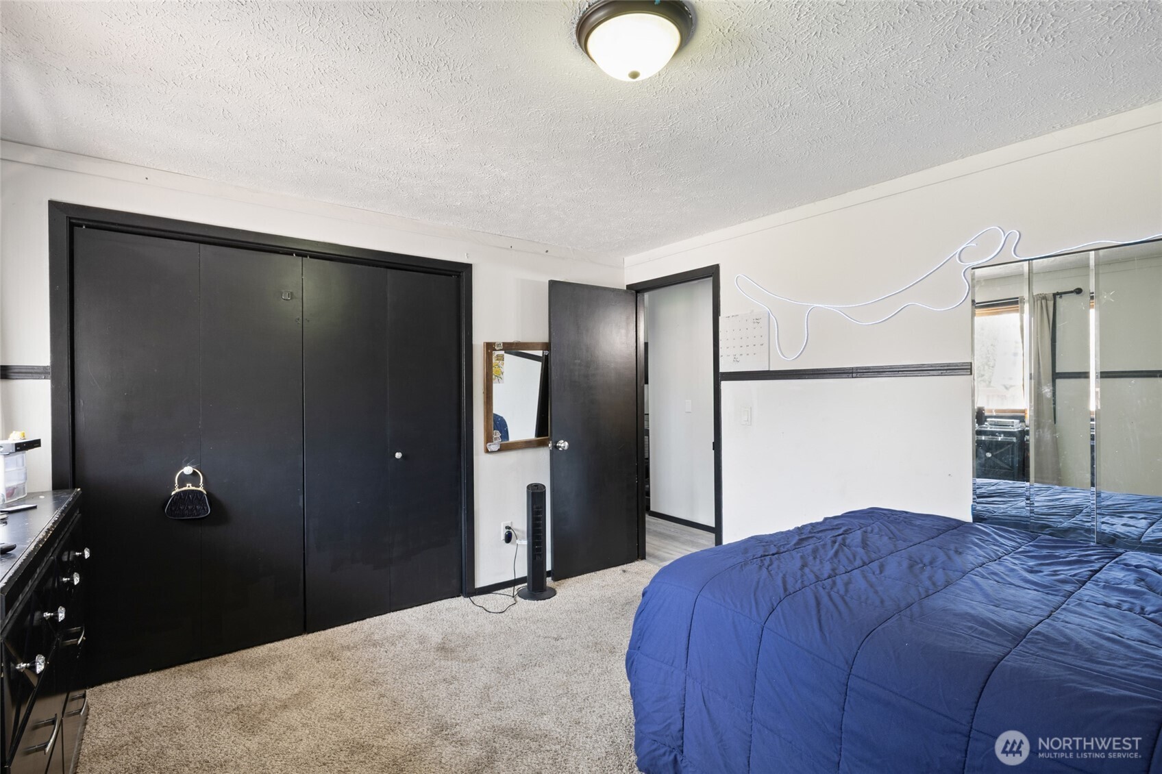 9307 Albert Way Southeast Moses Lake, WA 98837 - Photo 27 of 40 a bedroom with a bed and a dresser