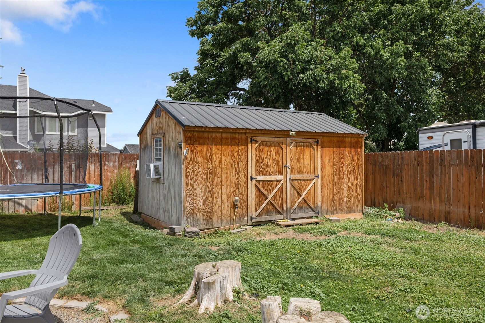 9307 Albert Way Southeast Moses Lake, WA 98837 - Photo 34 of 40 a view of a backyard with a garden and entertaining space