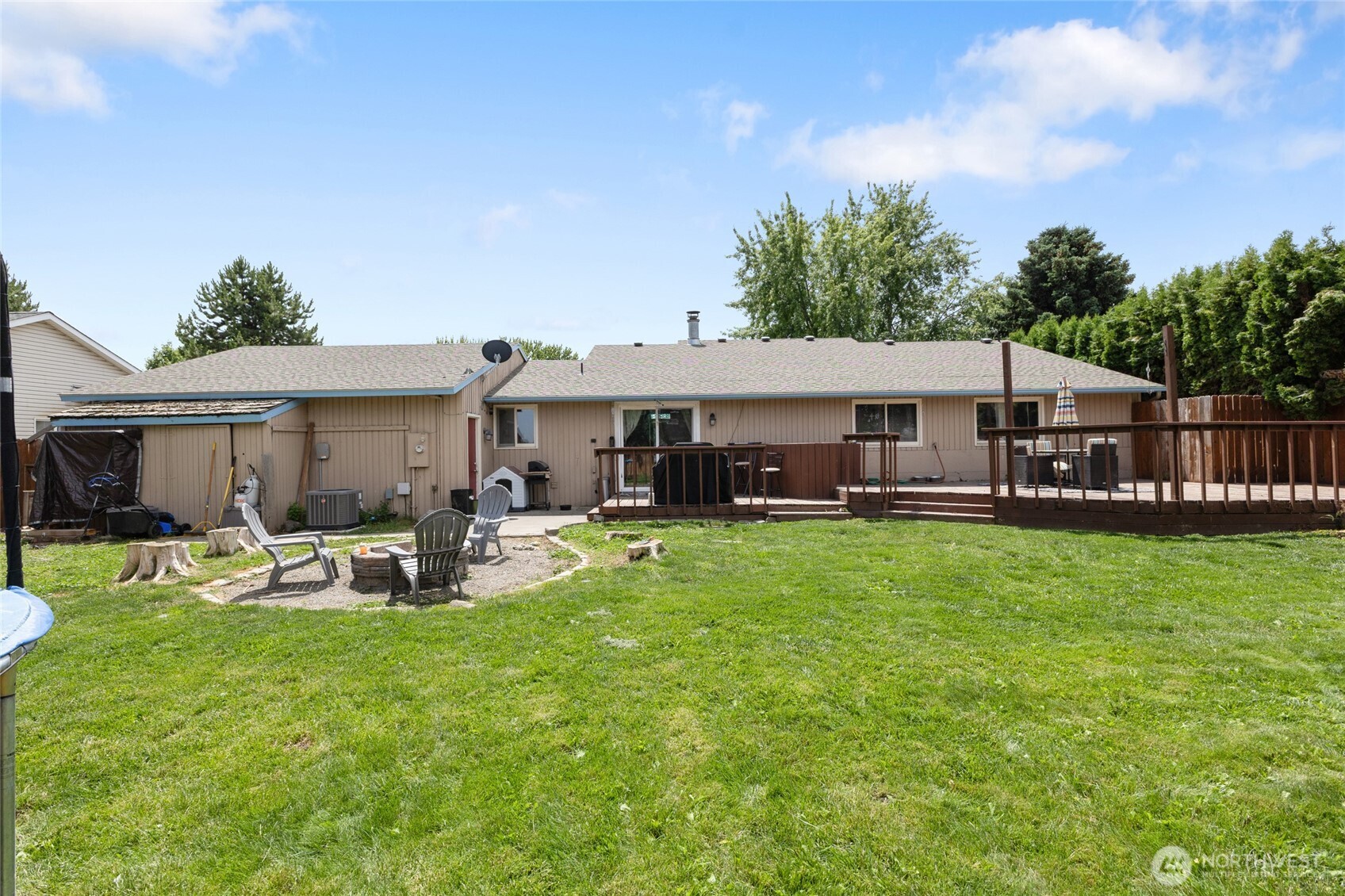 9307 Albert Way Southeast Moses Lake, WA 98837 - Photo 35 of 40 a view of a house with a yard patio and swimming pool