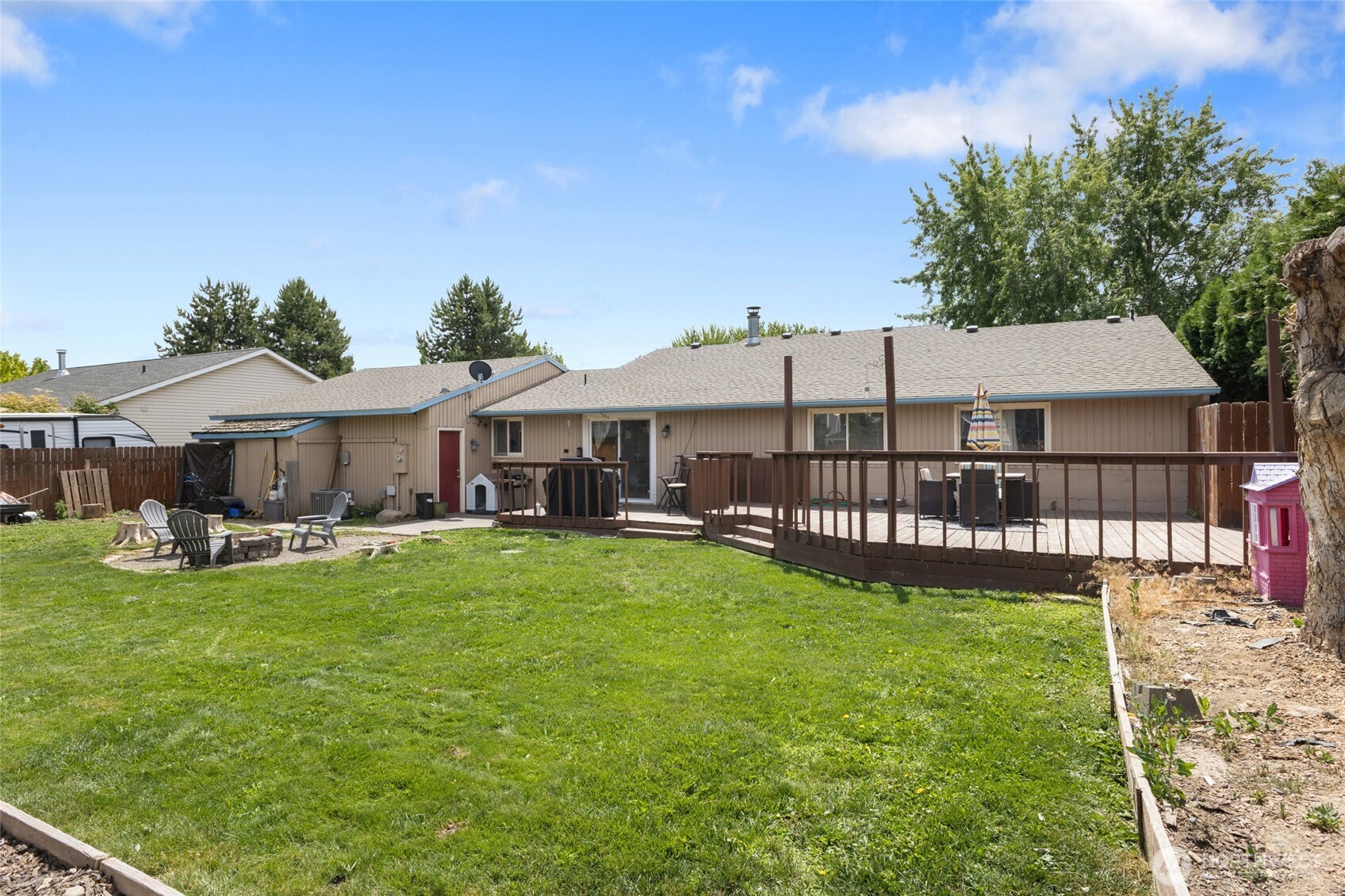 9307 Albert Way Southeast Moses Lake, WA 98837 - Photo 36 of 40 a view of a house with garden and deck