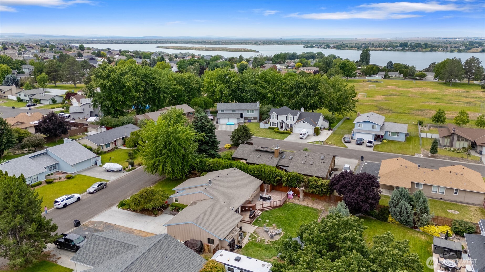 9307 Albert Way Southeast Moses Lake, WA 98837 - Photo 38 of 40 an aerial view of a houses with a lake view