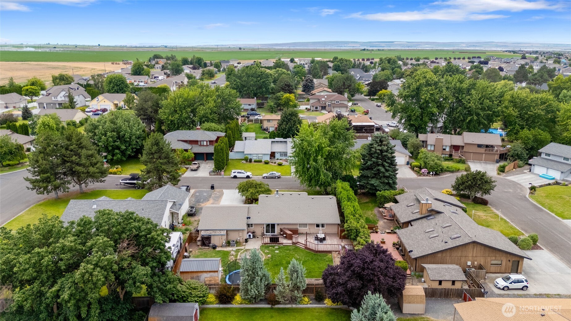 9307 Albert Way Southeast Moses Lake, WA 98837 - Photo 39 of 40 an aerial view of a city with lots of residential buildings and mountain view in back