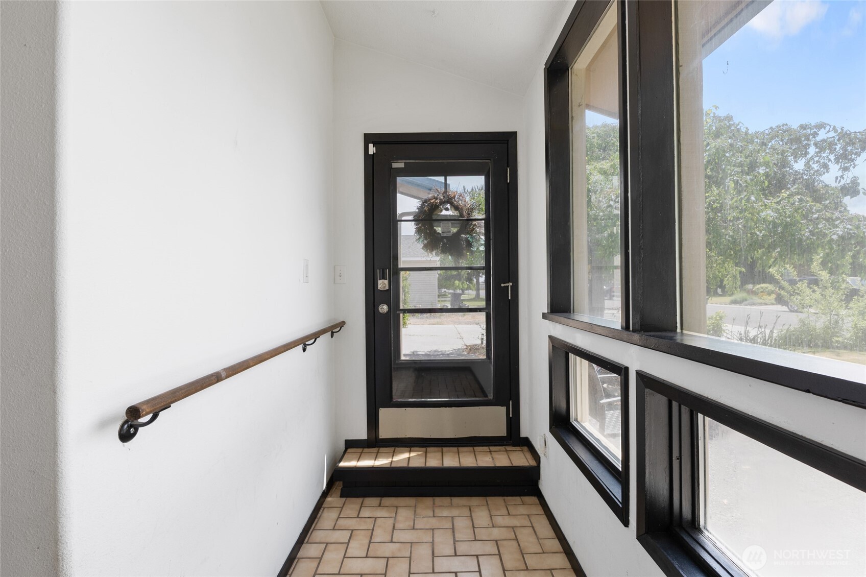 9307 Albert Way Southeast Moses Lake, WA 98837 - Photo 6 of 40 a view of a hallway with wooden floor and a window