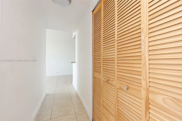 a view of a room that has a window in it