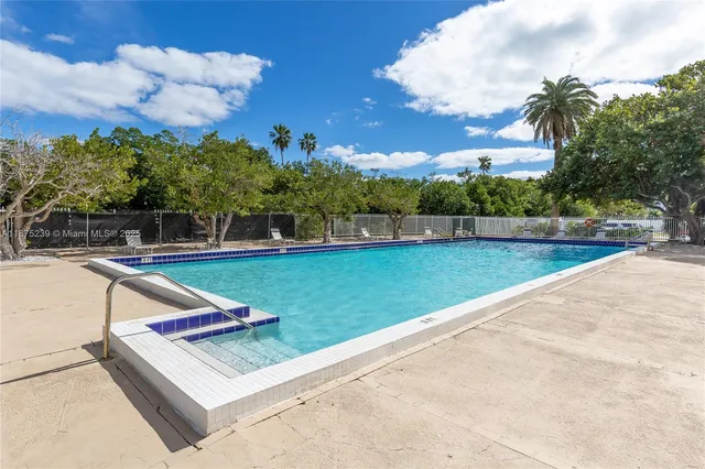 a view of a bench in a park