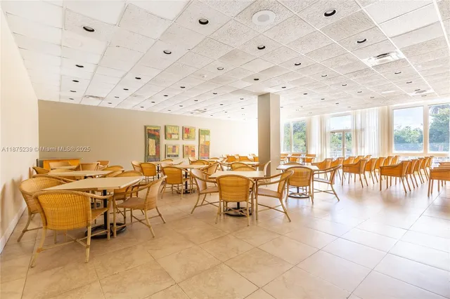 a group of people sitting at tables in a room