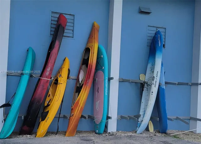 a view of walk in closet with clothes