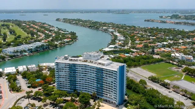 an aerial view of lake residential house with outdoor space and seating