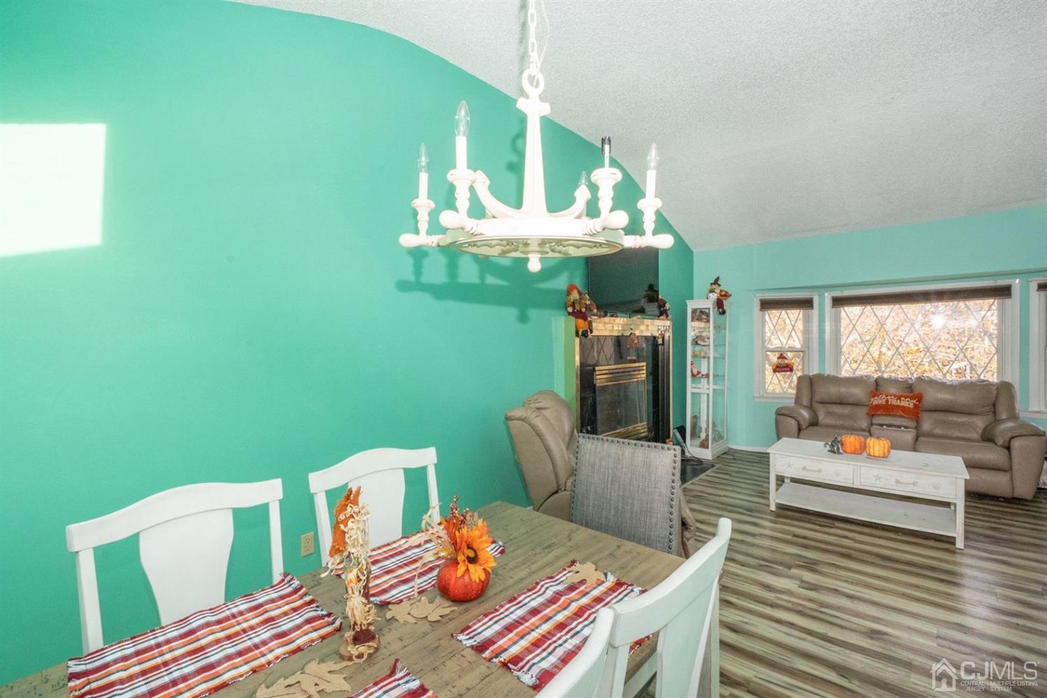 4 Hansen Road Old Bridge, NJ 08857 - Photo 11 of 39 a living room with furniture and a fireplace
