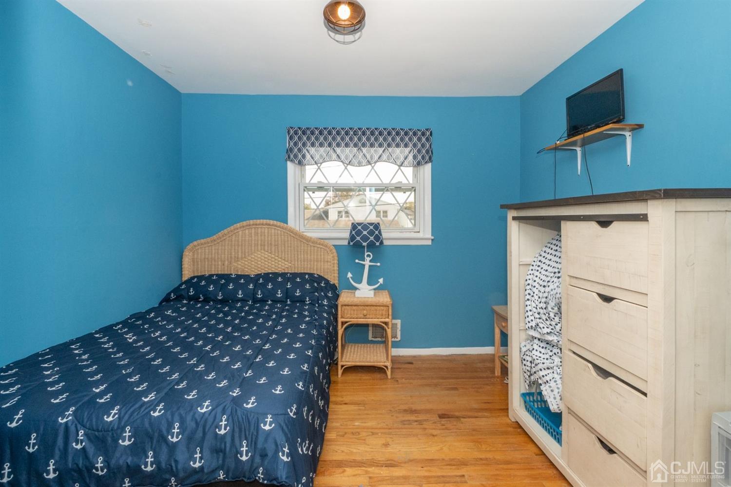 4 Hansen Road Old Bridge, NJ 08857 - Photo 20 of 39 a bedroom with a bed and a window