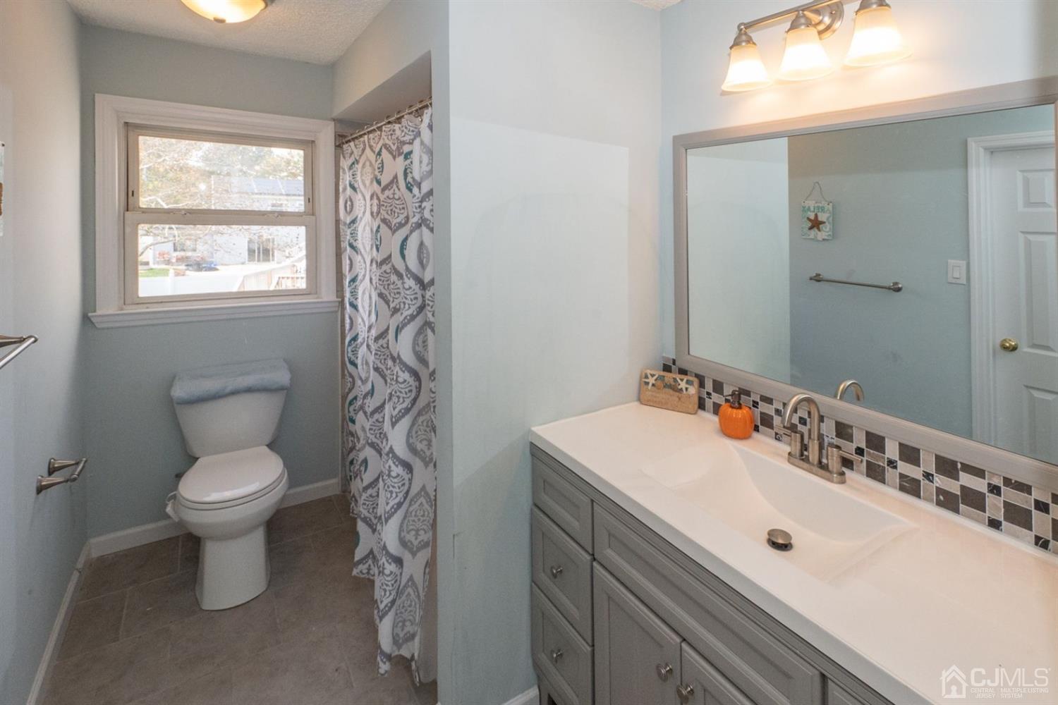 4 Hansen Road Old Bridge, NJ 08857 - Photo 21 of 39 a bathroom with a sink toilet and shower