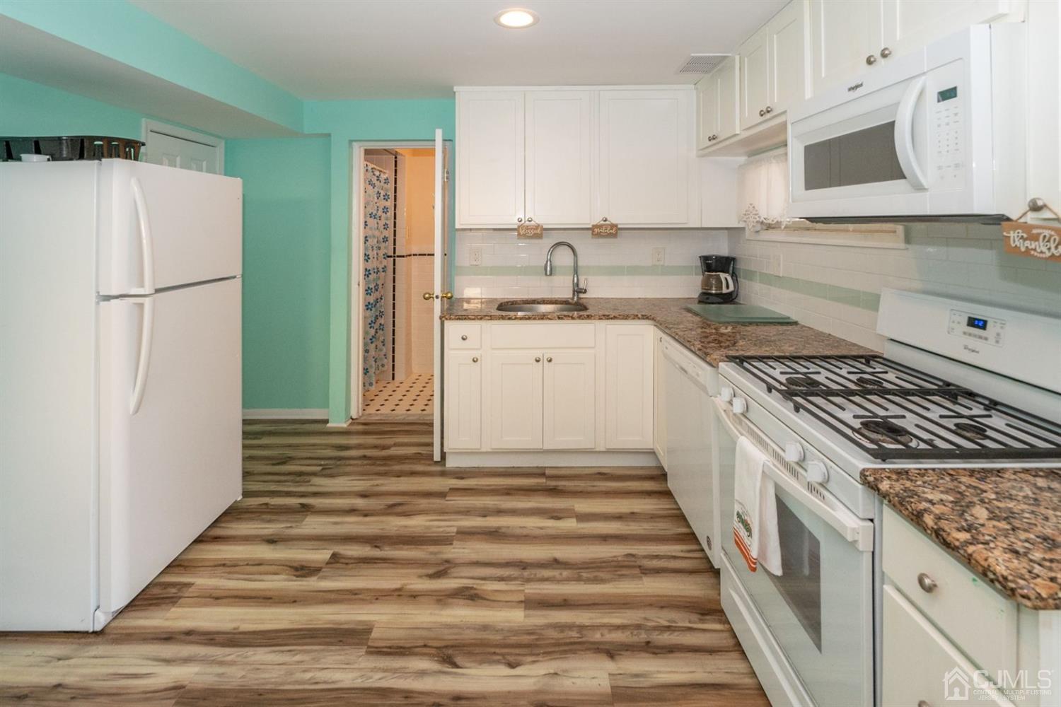 4 Hansen Road Old Bridge, NJ 08857 - Photo 26 of 39 a kitchen with granite countertop a refrigerator and a sink