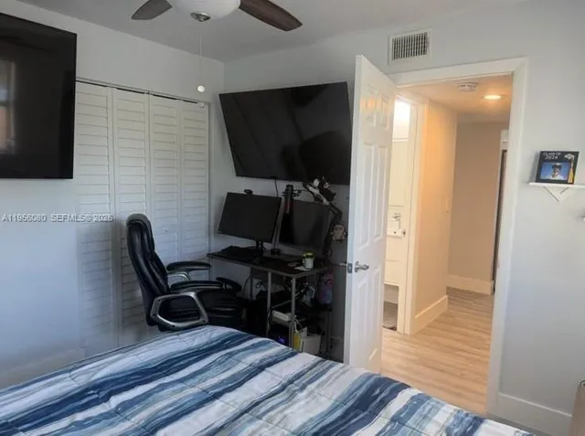 a view of a hallway with washer and dryer