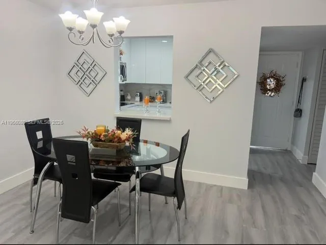 a kitchen with a sink and wooden cabinets
