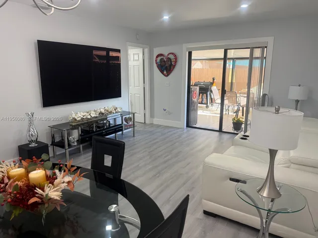 a white toilet sitting next to a sink