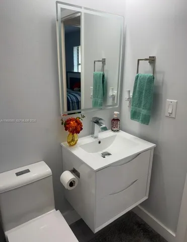 a dining room with furniture and a floor to ceiling window