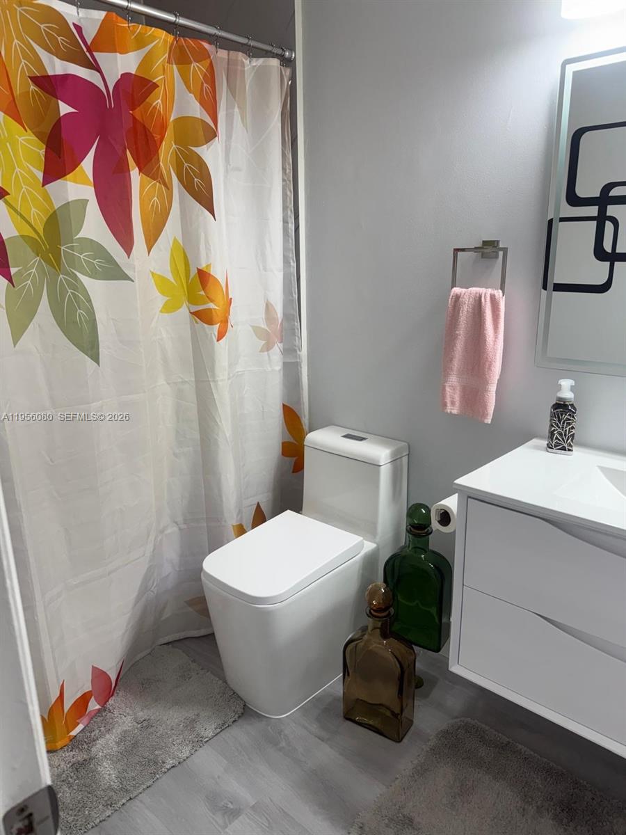 1327 Towhee Street Homestead, FL 33035 - Photo 31 of 31 a bathroom with a sink toilet and shower