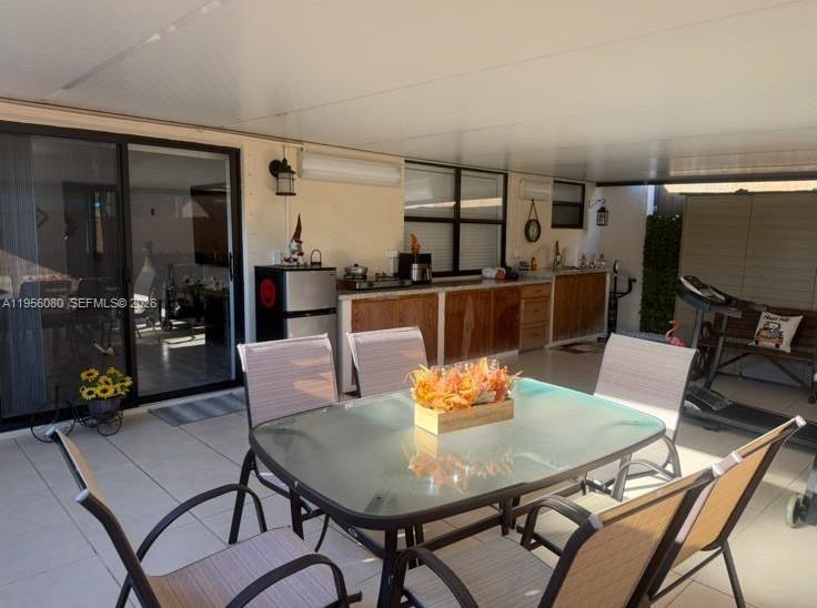 1327 Towhee Street Homestead, FL 33035 - Photo 6 of 31 a view of a dining room with furniture