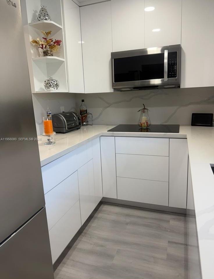 1327 Towhee Street Homestead, FL 33035 - Photo 9 of 31 a kitchen with a sink and a microwave